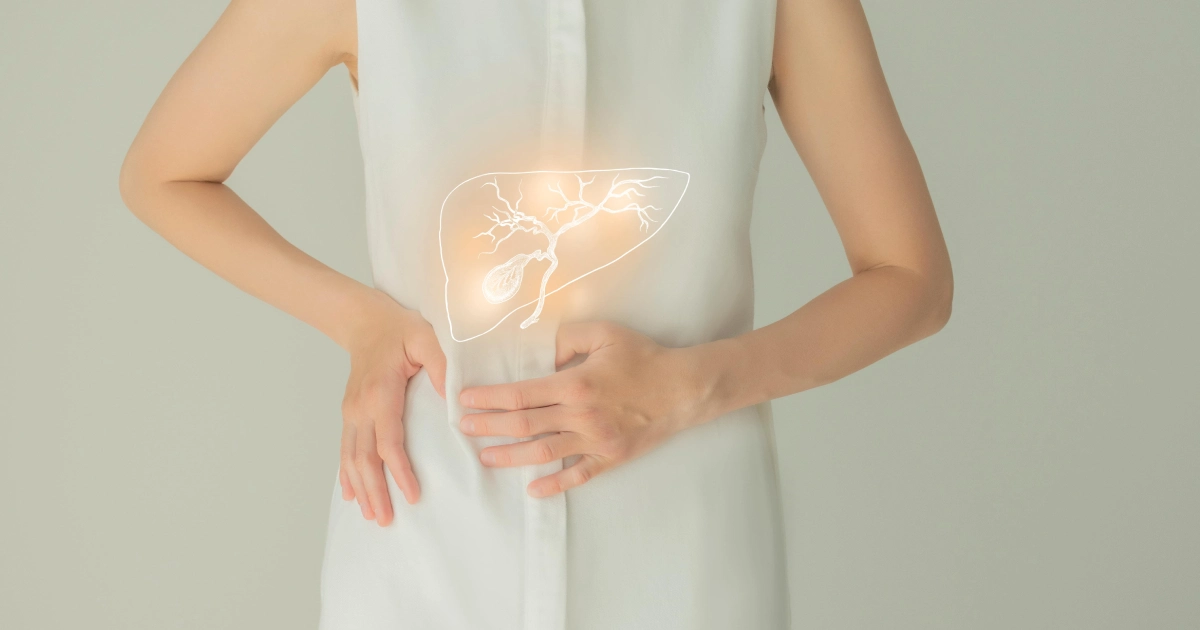 Woman holding her side with a glowing liver and gallbladder illustration over her torso, highlighting Emsella in Lima, OH.